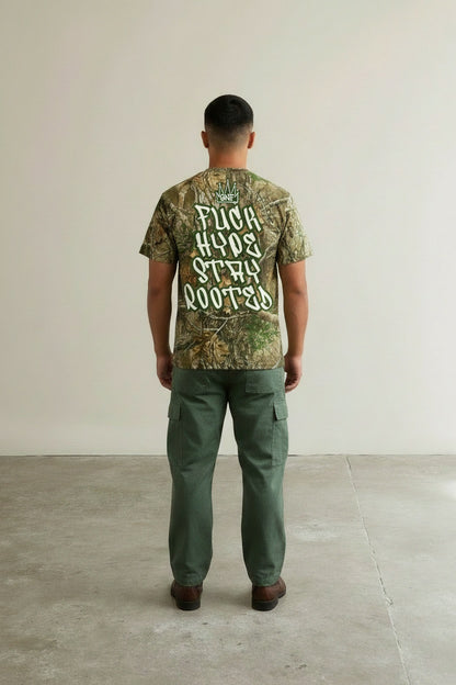 Back pose of the model wearing GNF Street - "Roots > Hype" Camo Tee