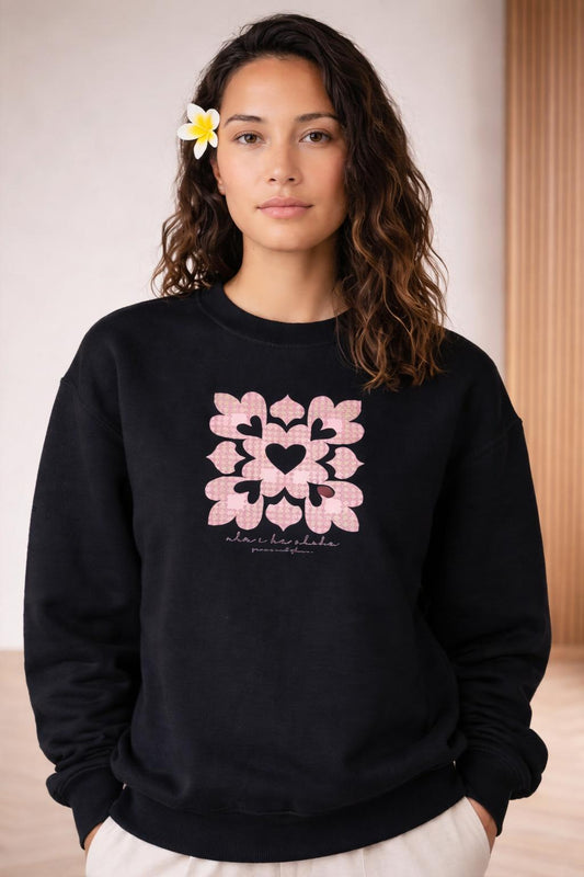 Close-up of the model wearing Ulu I Ke Aloha Crewneck Sweater