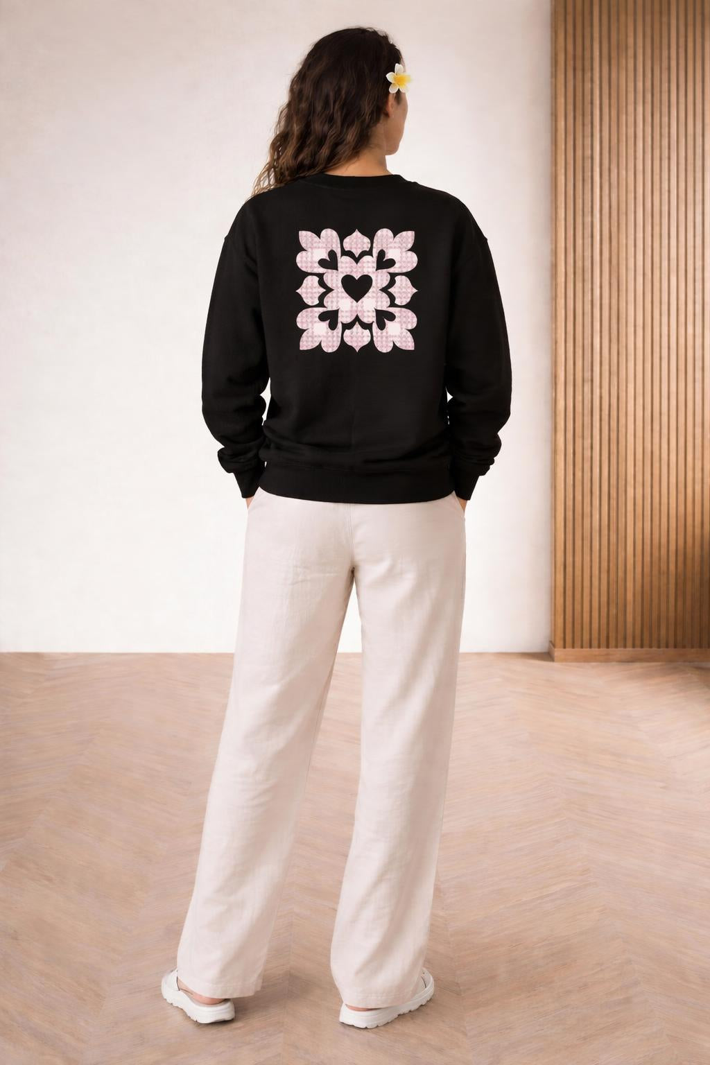 Back pose of the model wearing Ulu I Ke Aloha Crewneck Sweater
