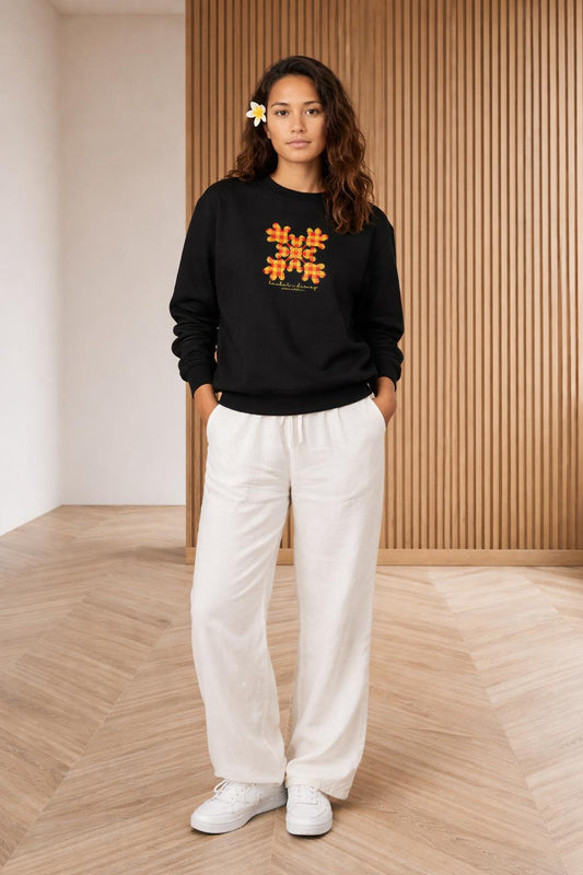 Full body view of the model wearing Huaka'i i Disney Crewneck Sweater